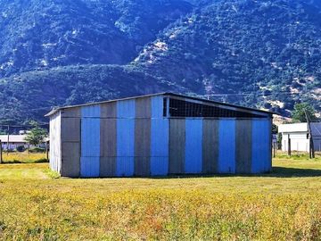 En venta, parcela de 5.000 m2., con casa de 2 dormitorios, en El Melón, Nogales.  100 M$