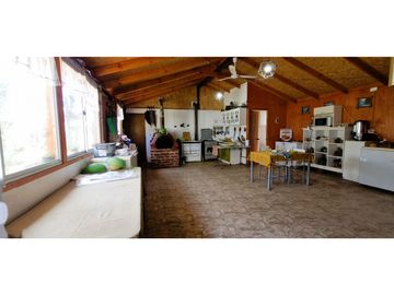 Venta parcela de 18.000 m2., casa, cabaña y galpón, con maquinaria de maestranza, en La Calera. 21.308 UF.