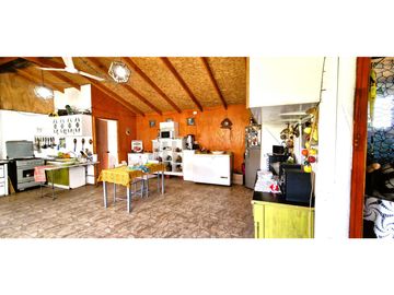 Venta parcela de 18.000 m2., casa, cabaña y galpón, con maquinaria de maestranza, en La Calera. 21.308 UF.