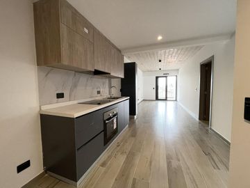 Departamento monoambiente con balcón y terraza