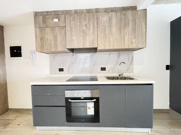 Departamento monoambiente con balcón y terraza