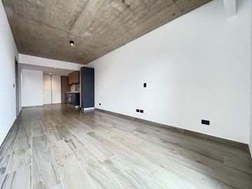 Departamento monoambiente con balcón y terraza