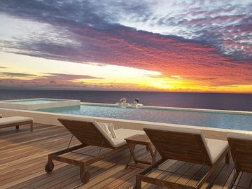Apartamento cerca del malecón, terraza con alberca y vista al mar, venta Cozumel