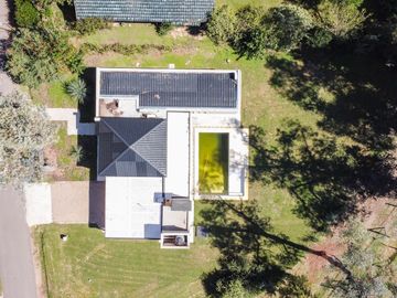 Venta de casa 3 dormitorios en Club Campos de Golf Las Praderas de Luján a estrenar