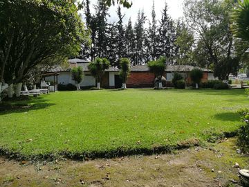 VENTA TERRENO COMERCIAL CAYAMBE, 10819M2 FRENTE A LA PANA NORTE