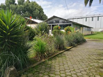 VENTA TERRENO COMERCIAL CAYAMBE, 10819M2 FRENTE A LA PANA NORTE