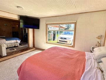 Parcela con linda casa en condominio Lomas de Monteverde