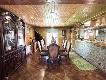 Parcela con linda casa en condominio Lomas de Monteverde