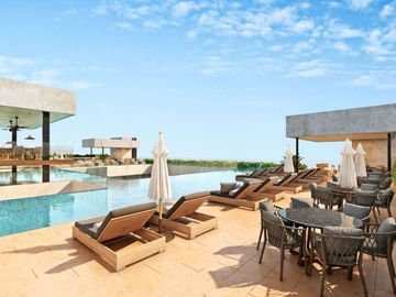 Apartamento a pasos de la Quinta Avenida, rooftop, en venta Playa del Carmen.