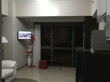 Fully furnished executive studio condo with parking