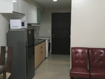 Fully furnished executive studio condo with parking