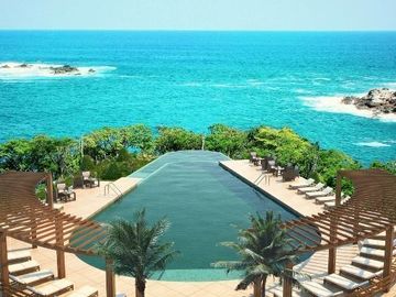 Departamento con acceso al mar y servicio de mesero en la playa, restaurante