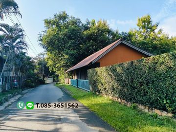 Land for sale in Chiang Mai Hangdong-Samoeng Road Near Flora Creek Hotel, a wide stream running through the land.