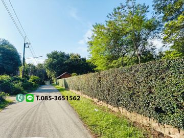 Land for sale in Chiang Mai Hangdong-Samoeng Road Near Flora Creek Hotel, a wide stream running through the land.