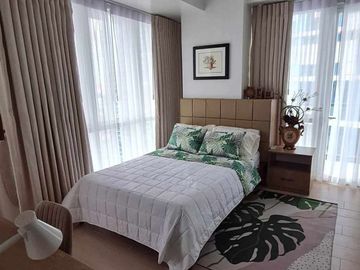 furnished 2-bedroom condo unit with 1-car park, for sale in Mactan Newtown