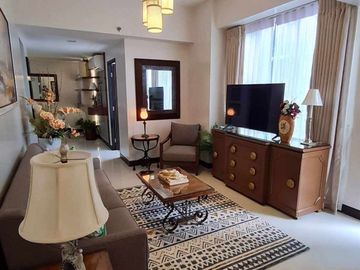 furnished 2-bedroom condo unit with 1-car park, for sale in Mactan Newtown
