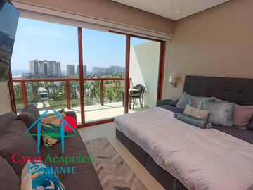 Depa de playa en renta mensual y vacacional. Terraza con vista a los jardines y albercas