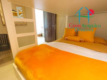 Depa de playa en renta mensual y vacacional. Terraza con vista a los jardines y albercas