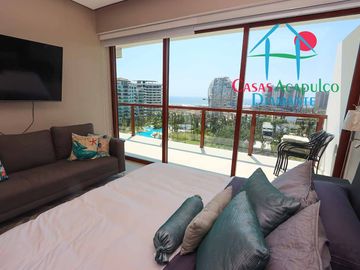 Depa de playa en renta mensual y vacacional. Terraza con vista a los jardines y albercas