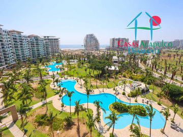 Depa de playa en renta mensual y vacacional. Terraza con vista a los jardines y albercas
