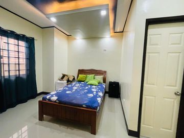 FOR SALE PRE OWNED HOUSE WITH EXTRA LOT ALONG MAIN ROAD NEAR CLARK AND NLEX