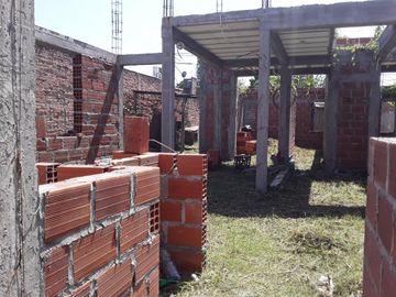 vendo terreno con construccion