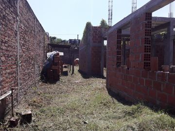vendo terreno con construccion