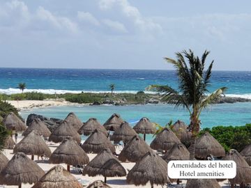 Departamento de dos pisos frente a la alberca, comunidad con acceso al mar, venta Sirenis, Tulum.
