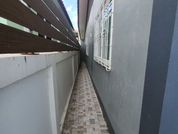 For Sale - One-Story Twin House in Sukhawadi Soi, Sung Noen, Nakhon Ratchasima. The house is situated on a 37 square wah plot and features 2 bedrooms