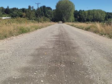 Parcela 10.000 m2 a orilla de camino