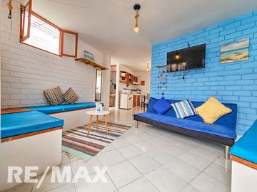 VENTA DE ACOGEDOR DEPARTAMENTO TIPO BUNGALOW CON TERRAZA, EN CONDOMINIO CERRADO PLAYA LOS PULPOS.