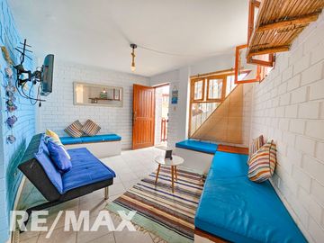 VENTA DE ACOGEDOR DEPARTAMENTO TIPO BUNGALOW CON TERRAZA, EN CONDOMINIO CERRADO PLAYA LOS PULPOS.