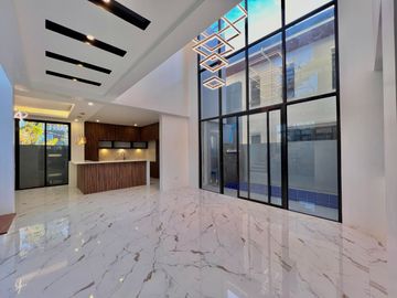 Experience luxury living in this brand new, three-story house and lot nestled within the prestigious Greenwoods Executive Village