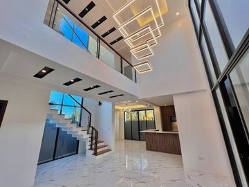 Experience luxury living in this brand new, three-story house and lot nestled within the prestigious Greenwoods Executive Village