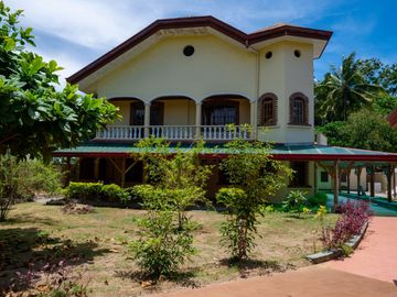 Beautiful Spanish Style 4 BR/4Bath home in a fully enclosed gated property