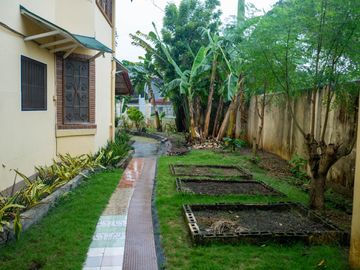 Beautiful Spanish Style 4 BR/4Bath home in a fully enclosed gated property