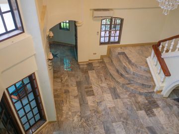 Beautiful Spanish Style 4 BR/4Bath home in a fully enclosed gated property