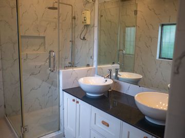 Beautiful Spanish Style 4 BR/4Bath home in a fully enclosed gated property