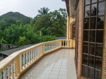 Beautiful Spanish Style 4 BR/4Bath home in a fully enclosed gated property