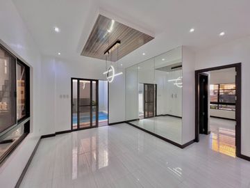 Experience luxury living in this brand new corner house and lot complete with a pool, nestled within the prestigious Greenwoods Executive Village