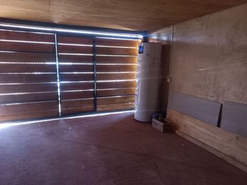 Nogales, en venta parcela plana de 5000 mts con casa sólida y urbanización completa.