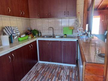 Nogales, en venta parcela plana de 5000 mts con casa sólida y urbanización completa.