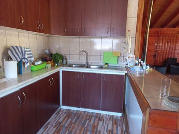 Nogales, en venta parcela plana de 5000 mts con casa sólida y urbanización completa.