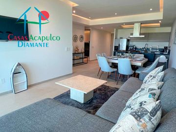 Departamento en renta vacacional, terraza con vista a las albercas y áreas comunes