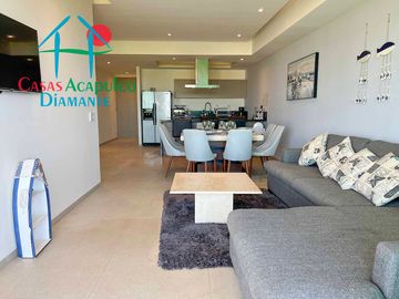 Departamento en renta vacacional, terraza con vista a las albercas y áreas comunes