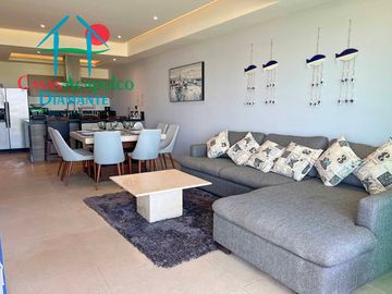 Departamento en renta vacacional, terraza con vista a las albercas y áreas comunes