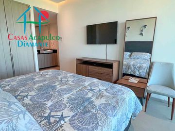 Departamento en renta anual, terraza con vista a las albercas y áreas comunes