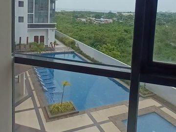 1 bedroom corner unit One Manchester Place condo 632 overlooking the pool, free beach access  Mactan Newtown
