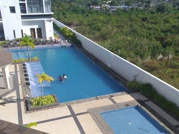 1 bedroom corner unit One Manchester Place condo 632 overlooking the pool, free beach access  Mactan Newtown