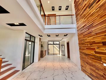 Experience modern comfort in this brand new house and lot, boasting a spacious living area, nestled within the serene surroundings of Greenwoods Execu